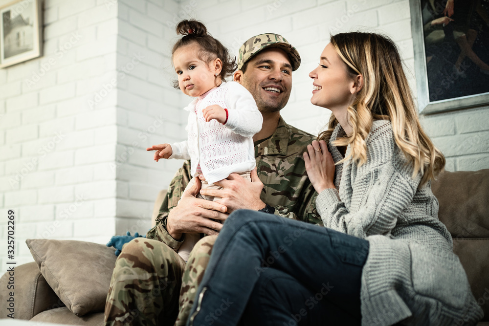 Happy military family enjoying in time together at home.
